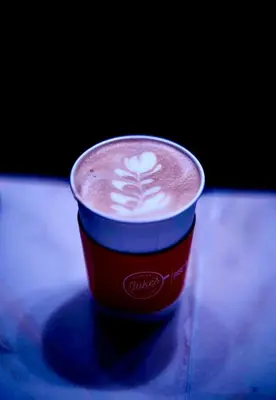 a cup of coffee sitting on a table at The Knickerbocker in New York