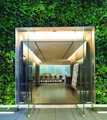 a lobby of a building with a green wall at The Knickerbocker in New York