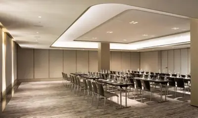 a room with rows of tables and chairs at The Knickerbocker in New York