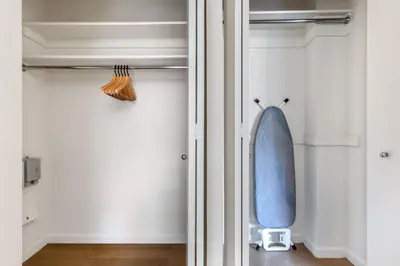 a room with a surfboard hanging on the wall at Blueground UWS gym elevator nr Central Park NYC-1443 in New York