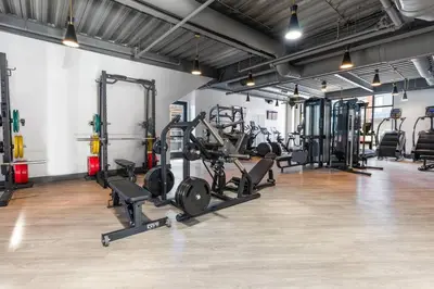 a gym with lots of treadmills and machines at Stunning 1-BD - City Views - Near Fishtown in Philadelphia