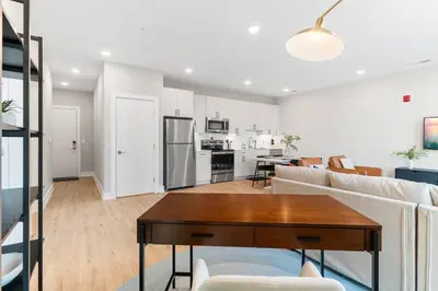 a living room with a couch and a table at Stunning 1-BD - City Views - Near Fishtown in Philadelphia