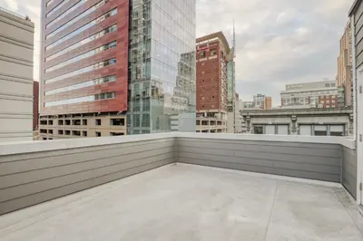 a balcony with a view of the city at One Sky Loft in Philadelphia