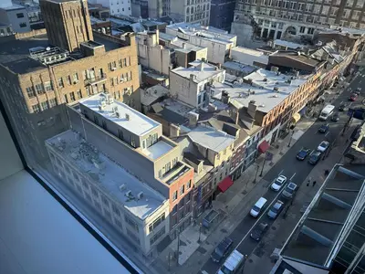 an aerial view of a city with buildings and a street at One Sky Loft in Philadelphia