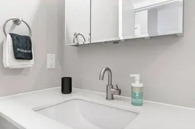a kitchen counter with a sink and a towel at 1BD - Sleeps 4 - Harbor Views - Near Fish Town- in Philadelphia
