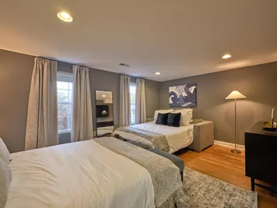 a hotel room with two beds and a window at The Lambertville Haven in Lambertville