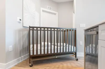 a baby crib in a room with a window at Amazing City Views - Sleeps 6 - Near Fishtown in Philadelphia