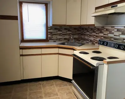 a kitchen with a stove and a sink at Private and cozy house with one bedroom and one bathroom, MetLife Stadium FIFA World Cup 35 minutes away in Perth Amboy