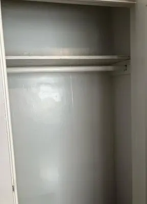 a glass door of a closet with a empty shelf at Private and cozy house with one bedroom and one bathroom, MetLife Stadium FIFA World Cup 35 minutes away in Perth Amboy