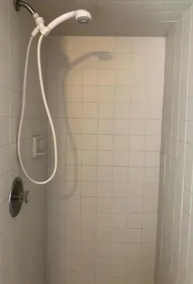 a shower with a shower head in a bathroom at Private and cozy house with one bedroom and one bathroom, MetLife Stadium FIFA World Cup 35 minutes away in Perth Amboy