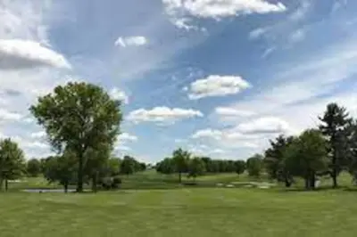 a green field with trees and a cloudy sky at Golf view family friendly 3 bed room Bridgewater apt close to Bridgewater Mall in Bridgewater