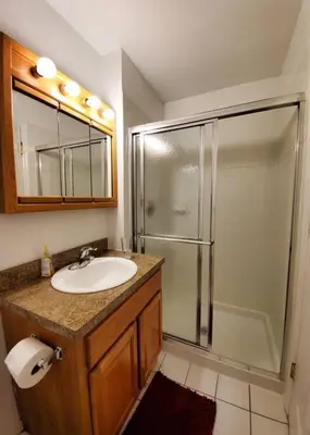 a bathroom with a sink and a shower at Golf view family friendly 3 bed room Bridgewater apt close to Bridgewater Mall in Bridgewater
