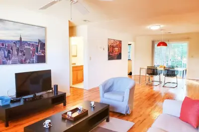 a living room with a couch and a tv at Golf view family friendly 3 bed room Bridgewater apt close to Bridgewater Mall in Bridgewater