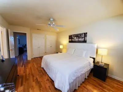 a bedroom with a white bed and a ceiling fan at Golf view family friendly 3 bed room Bridgewater apt close to Bridgewater Mall in Bridgewater