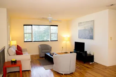 a living room with a white couch and a tv at Golf view family friendly 3 bed room Bridgewater apt close to Bridgewater Mall in Bridgewater