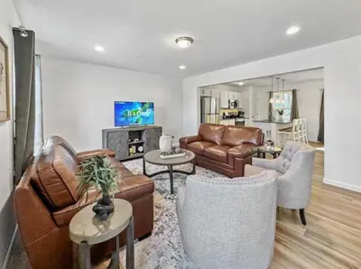 a living room with a couch and chairs and a table at Luxurorious Townhome In Reading in Mount Penn