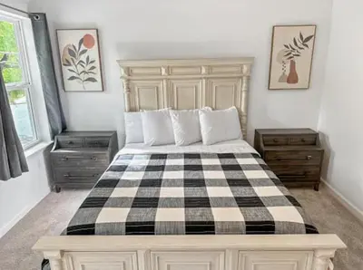 a bedroom with a black and white checkered bed at Luxurorious Townhome In Reading in Mount Penn