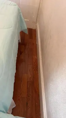 a room with a bed and a wooden floor at 2218 N Colorado Double Rooms in Eldorado
