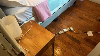 a bed with a wooden table next to a wooden floor at 2218 N Colorado Double Rooms in Eldorado
