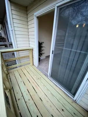a screened porch with a large sliding glass door at Comfy Stay Modern in Highspire