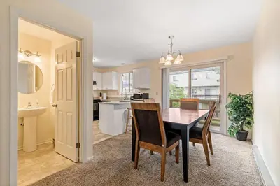 a kitchen and dining room with a table and chairs at Comfy Stay Modern in Highspire