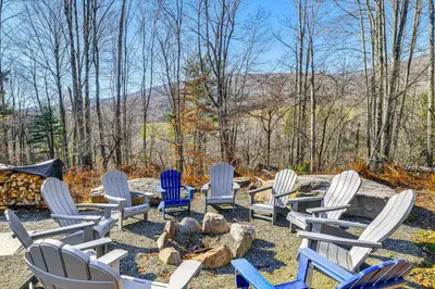 a group of chairs sitting around a fire pit at Mountain Views and Brook Access Home in Arkville! in Arkville