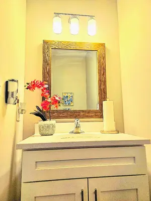 a bathroom with a sink and a mirror at Hidden Gem in Norristown