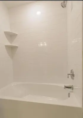 a white tub with a faucet in a bathroom at Hidden Gem in Norristown
