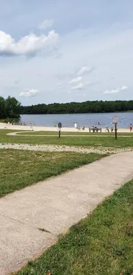 a sidewalk next to a beach with people on it at poconos mountain luxury cozy vacational house in the heart of Poconos in Tobyhanna