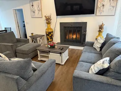 a living room with two couches and a fireplace at poconos mountain luxury cozy vacational house in the heart of Poconos in Tobyhanna