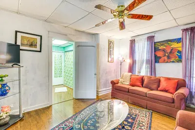 a living room with a couch and a ceiling fan at Bethlehem Home with Patio and Amazing Sunset Views! in Bethlehem