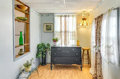 a room with a black dresser and a window at Bethlehem Home with Patio and Amazing Sunset Views! in Bethlehem