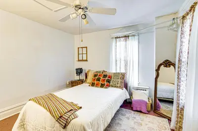 a bedroom with a bed and a ceiling fan at Bethlehem Home with Patio and Amazing Sunset Views! in Bethlehem