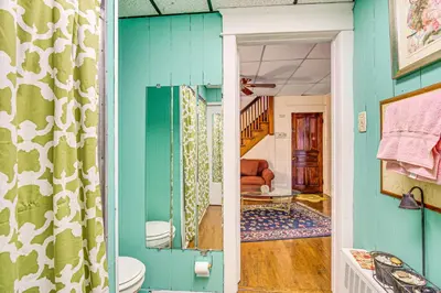 a bathroom with a green and white wall at Bethlehem Home with Patio and Amazing Sunset Views! in Bethlehem