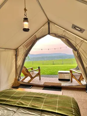 a tent with a view of a field at Hilltop Hideaway at Moon Valley Campground in Vernon Township
