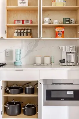 a kitchen with a counter with pots and pans at NYC Gateway, 30minutes from Manhattan in Jersey City