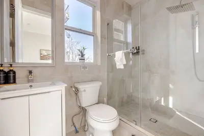 a bathroom with a toilet and a shower and a sink at NYC Gateway, 30minutes from Manhattan in Jersey City