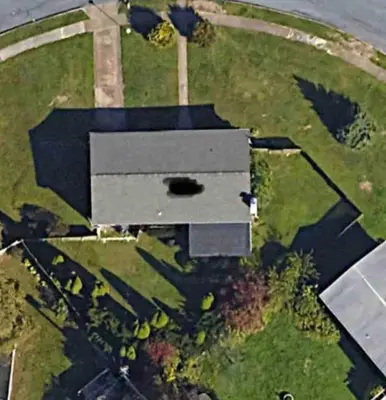 an aerial view of a building in a field at Joyful 5 Bedroom Home in Harrisburg