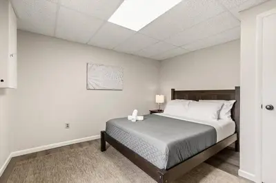 a bedroom with a bed and a skylight at Joyful 5 Bedroom Home in Harrisburg