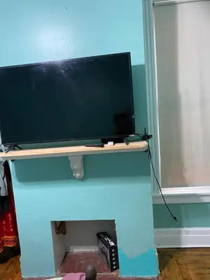 a computer monitor on a desk in a room at Scenic easy go to TIMES SQUARE in North Bergen