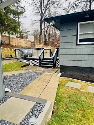 a house with a set of stairs leading to a porch at Vernon Cozy 2BD Pet-Friendly Mountain Creek in Vernon