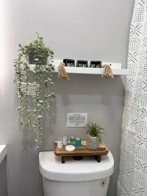 a bathroom with a toilet with a wooden tray on top at Vernon Cozy 2BD Pet-Friendly Mountain Creek in Vernon
