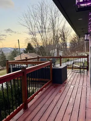 a wooden deck with a bench on top of it at Vernon Cozy 2BD Pet-Friendly Mountain Creek in Vernon