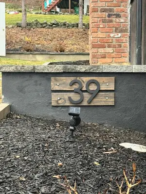 a sign with the number on the side of a building at Vernon Cozy 2BD Pet-Friendly Mountain Creek in Vernon