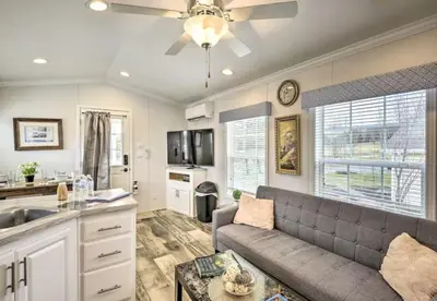 a living room with a couch and a kitchen at Clydesdale Cottage by Equestrian House in Pleasant Mount