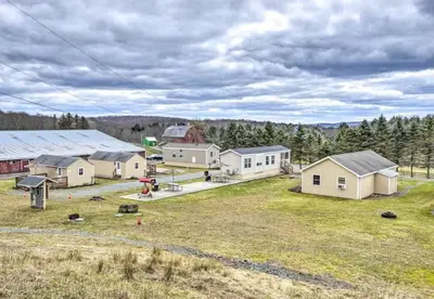 an aerial view of a farm with houses at Clydesdale Cottage by Equestrian House in Pleasant Mount