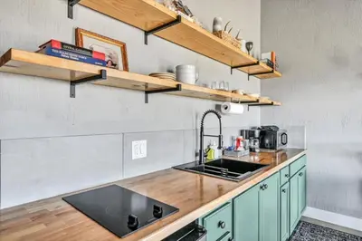 a kitchen with a sink and a counter top at Paceful & Stylish Rural Retreat in Pine Grove