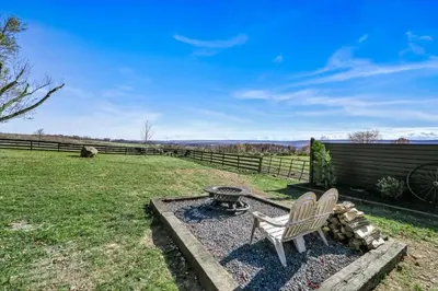 a yard with a bench and a fire pit at Paceful & Stylish Rural Retreat in Pine Grove