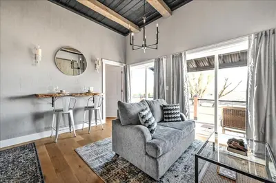a living room with a couch and a table at Paceful & Stylish Rural Retreat in Pine Grove