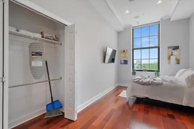 a white room with a bed and a window at Upscale NoLibs XL Studio - Pool & Gym in Philadelphia